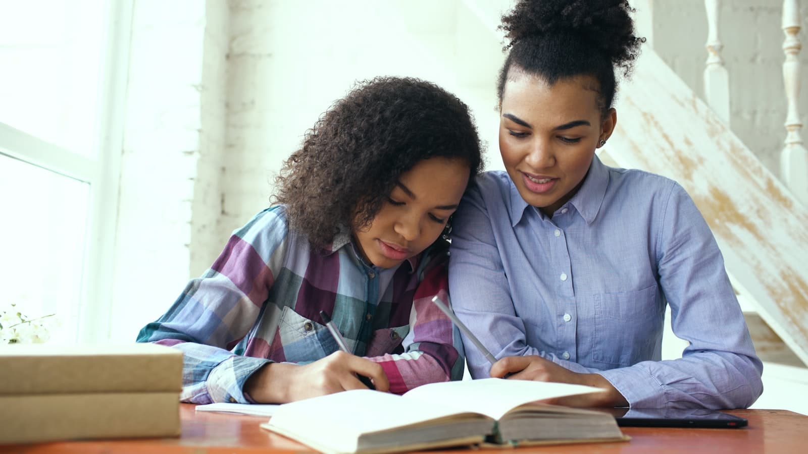 Tutor and student working together